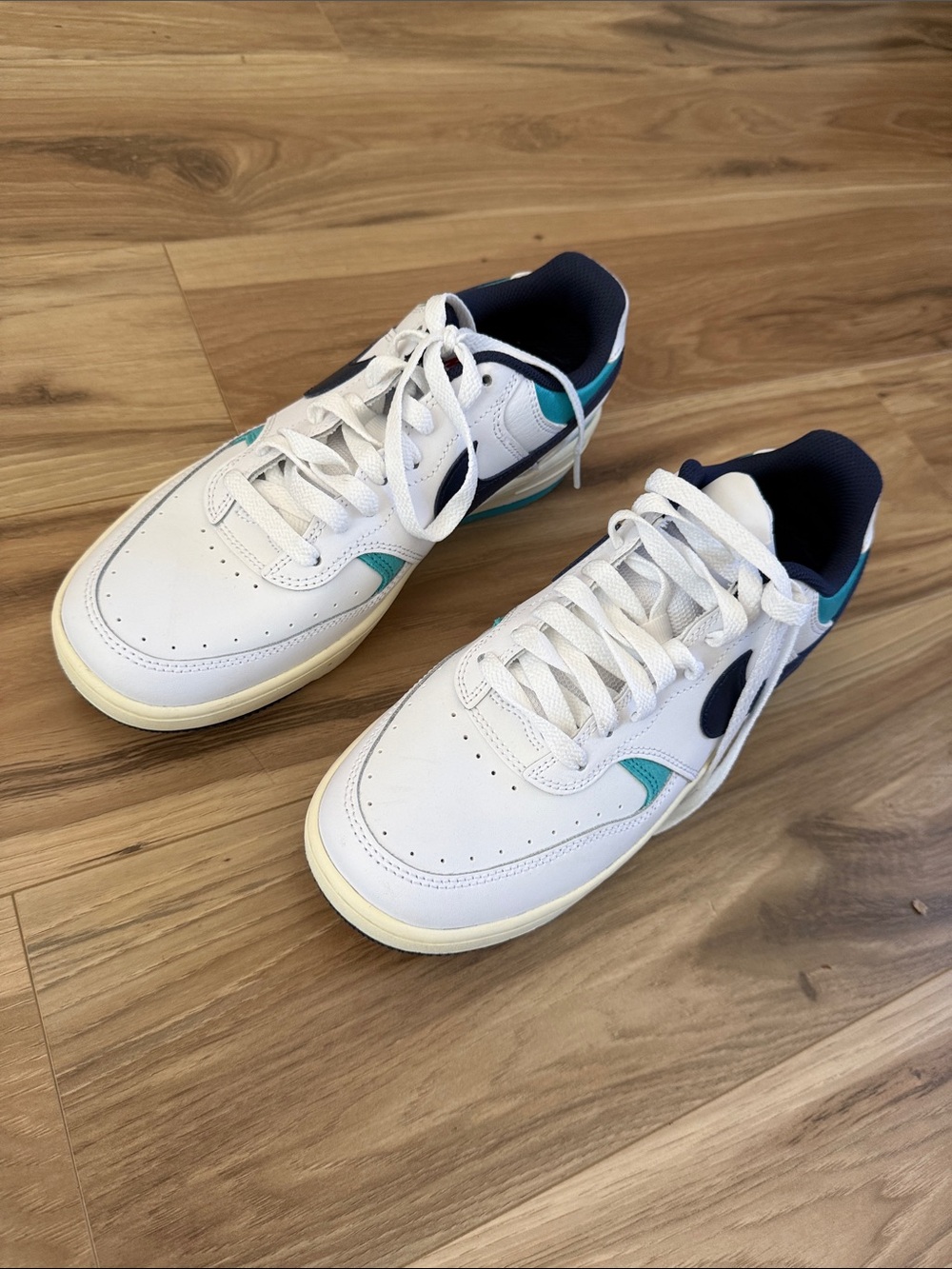 Nike Women's White Sneakers with Teal and Navy Accents